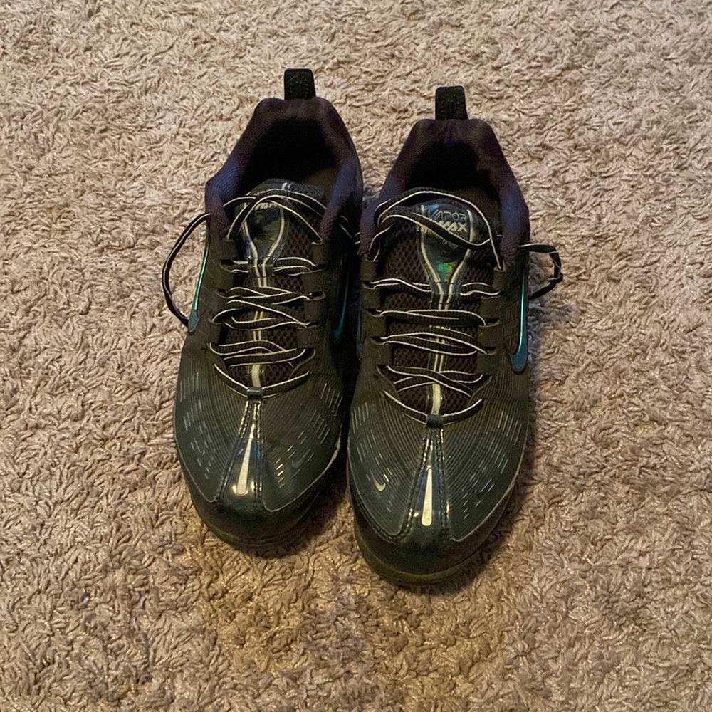 Very expensive and athletic shoes. Black, blue, and green.